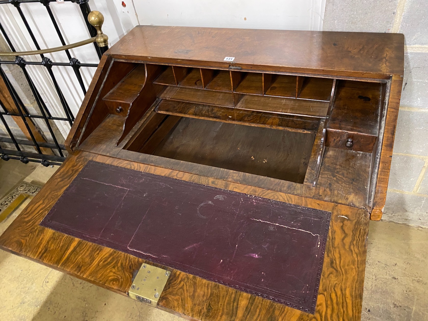 An 18th century walnut veneered bureau, adapted, fitted four graduating long drawers, width 97cm, depth 57cm, height 96cm